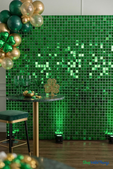 Emerald Green Shimmer Sequin Wall backdrop used for St. Patrick’s Day event décor with gold and green balloons, cocktail table, and clover décor – ShopWildThings