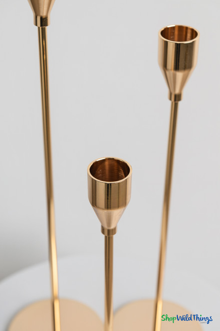 Close up of gold metal taper candle holder cups on long stem candle holders designed for standard 0.75 inch taper candles