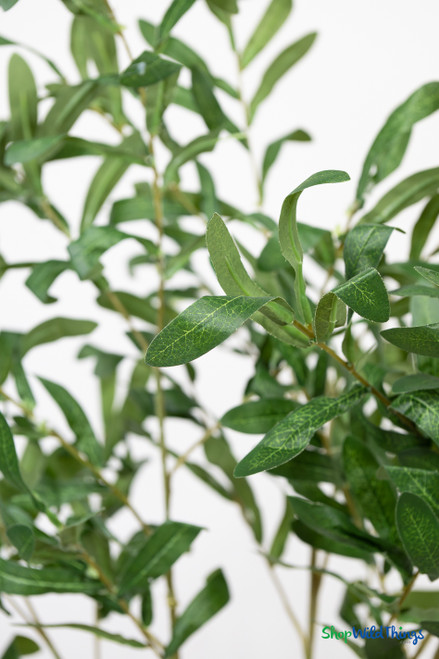 Close up of artificial olive branch foliage showing realistic veined green leaves on interchangeable branch – ShopWildThings