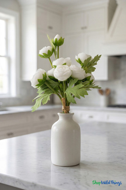 Real feel white ranunculus arranged in a small ceramic vase on a kitchen countertop – elegant artificial floral decor from ShopWildThings.com