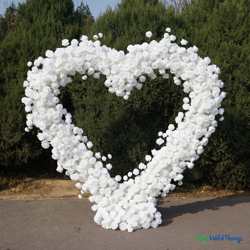 Luxury white rose heart arch wedding ceremony backdrop formal garden venue silk floral installation ShopWildThings.com