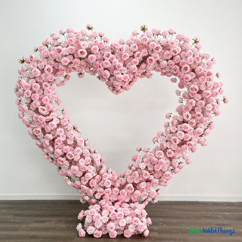 Pink silk rose heart shaped arch wedding backdrop symmetrical floral installation ShopWildThings.com