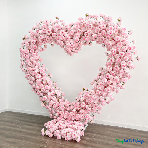 Pink heart shaped floral arch indoor setup premium silk rose wedding backdrop elegant event decor ShopWildThings.com