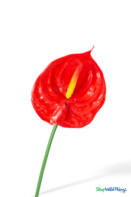 Close-up of Real Feel Red Anthurium Tropical Stem showing glossy red heart-shaped bloom, yellow textured spadix, and realistic waxy tropical flower finish