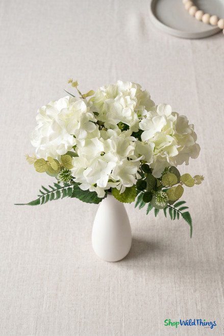 Overhead lifestyle view of Cream White Hydrangea Bouquet with 7 artificial stems arranged in white vase, ShopWildThings.com