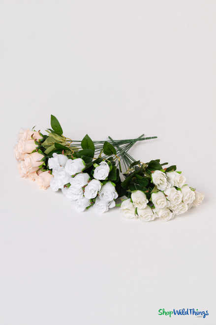 Three color options of 12-piece silk rose bud bundles in peach, white, and ivory for bridal bouquets and centerpieces