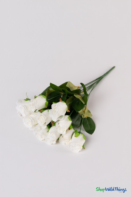 Ivory silk rose bud bundle lying flat to show 12 artificial rose sprays, bendable stems, and lifelike green leaves