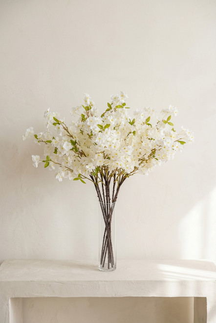 40" Faux Cream White Cherry Blossom Branch from ShopWildThings.com arranged in a clear glass vase for centerpieces and spring event styling