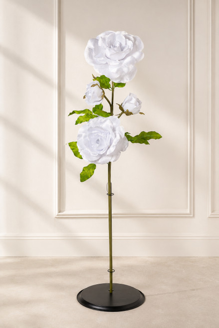 Oversized White Velvet Roses on Stem 52" styled in a minimal editorial interior with black flower holder base, ShopWildThings.com