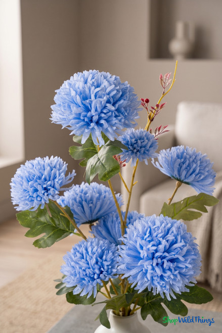 Blue Faux Chrysanthemum Bouquet – 27" Faux Floral Stem (8 Heads) styled in a neutral ceramic vase on a minimal coffee table in an editorial living room, ShopWildThings.com