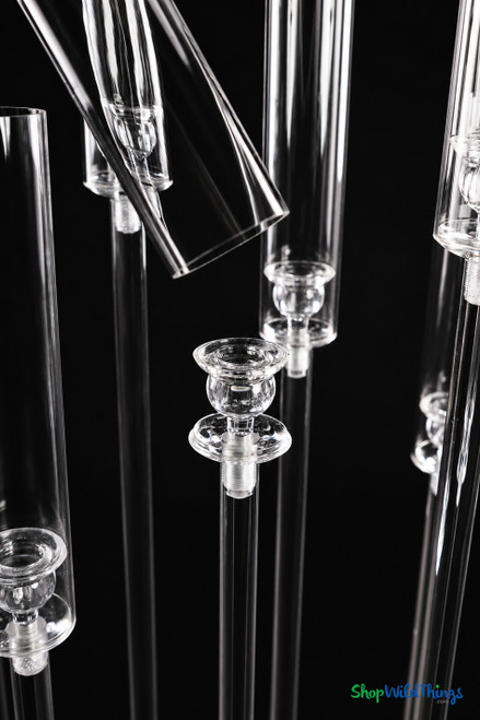 Close-up of premium clear acrylic hurricane sleeves and candle holders on the Isolde candelabra, showcasing crystal-clear transparency and elegant event styling details.