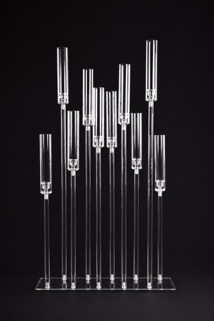 Angled view of the Isolde 10-stem acrylic hurricane candelabra featuring crystal-clear candle sleeves and customizable height arrangement for luxury event decor.