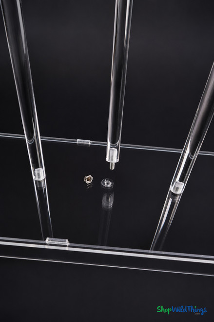 Close-up of the Gwendolyn acrylic candelabra base showing stem mounting points and clear acrylic construction.