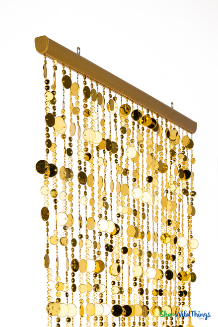 Gold acrylic bubble beaded curtain with 27 strands hanging from a sturdy rod, reflective metallic discs in multiple sizes create a shimmering doorway or event backdrop – ShopWildThings