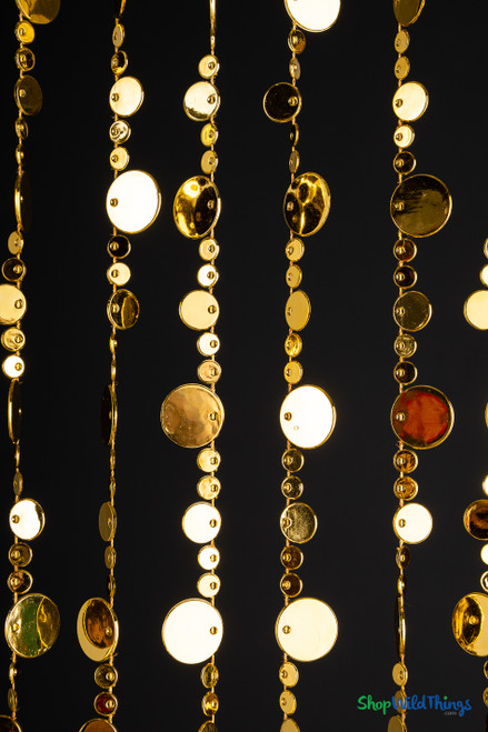 Cluster of gold metallic acrylic bubble beads hanging in strands, shimmering and reflective for glamorous party backdrops, photo shoots, or event entrances – ShopWildThings