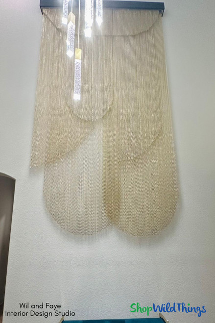 Create Showstopping Wall Art with Lynx Aluminum Chain Curtains by ShopWildThings.com! We offer a wide variety of Lynx curtains in stock and ready to ship (perfect for quick design updates!), but don't forget we can also fully customize your order.

From length and width to curtain rail type and even color, create a statement piece that's uniquely you.  Plus, these fire-resistant curtains (made from non-combustible aluminum) are perfect for retail and commercial spaces! Shop now and let your creativity flow!

Large Hanging Metal Chain Wall Art Decor – Interior Design