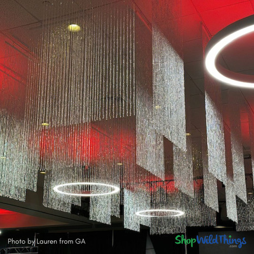 Available in ready to ship sizes from 6' to 20', finished with traditional curtain rods, or finished with satin rod pockets or even bendable rods, the Diamonds Collection is full of matching iridescent beaded columns, chandeliers, swags, and more! Available at ShopWildThings.com