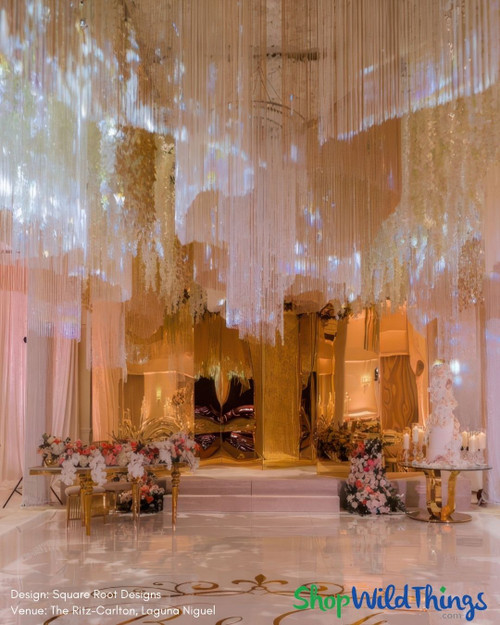 Create dazzling ceiling installation by layering Beaded, Metallic, and String Fringe Curtains by ShopWildThings.com
Need a custom color? Length? Our in-house fabrication team can make that happen!
Luxurious Wedding Reception – Grand Ceiling Decor Installation