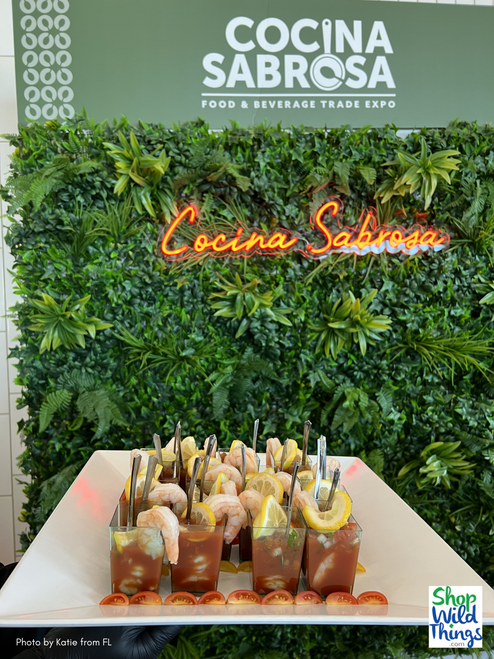 A feast for the eyes, Paradise Artificial Greenery Wall Panels by ShopWildThings.com are full of exotic, high density foliage, perfect creating a captivating backdrop that will make your attendees pop in their photos!