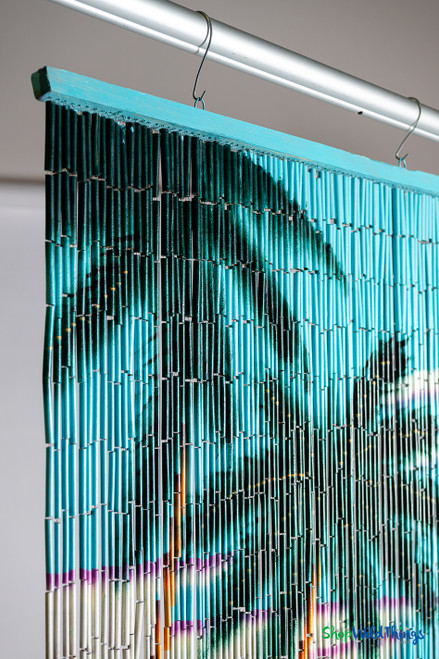 Full-length hand-painted bamboo curtain hanging in a studio – ShopWildThings.com
