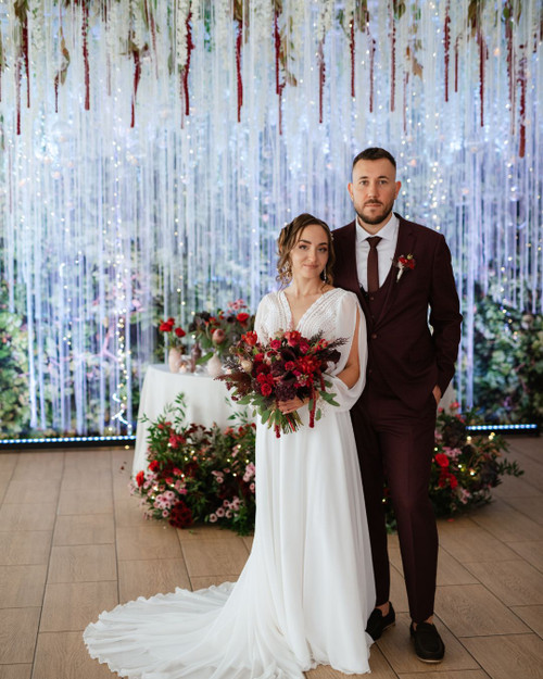From Ceiling to Backdrop, Fringe String Curtains by ShopWildThings.com Can Do It All! Create a stunning backdrop or add a touch of magic to your ceiling. Choose from our ready-to-go colors or customize them to match your event perfectly. Need Fire Rated Decor? We offer FR String Curtains as Well!

White and Red Wedding Reception Decor with String Fringe Curtains Ceiling Decor