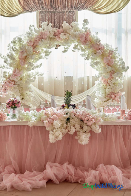 Create a Gorgeous Backdrop Arch with Dogwood and Cherry Blossom Silk Florals in Pinks and Creams and a Round Arch, all available at ShopWildThings.com – Pink and Cream Spring Wedding Reception Head Table Party Decor