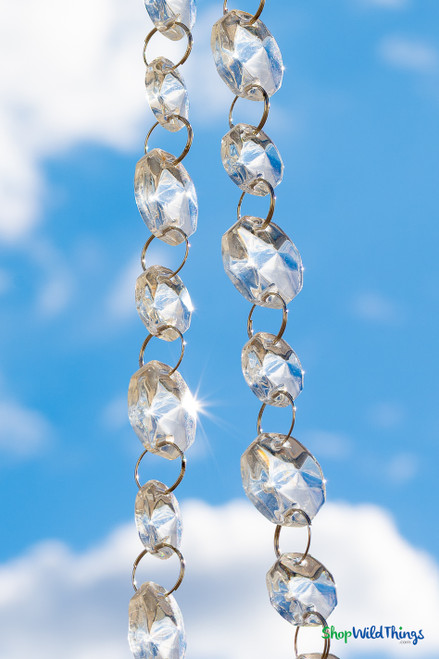 Crystal clear acrylic bead garland featuring two octagon bead sizes connected by jump rings, ideal for wedding reception decor, columns, and chandeliers from ShopWildThings.com