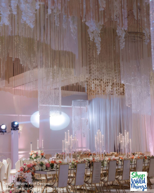 Create dazzling ceiling installation by layering Beaded, Metallic, and String Fringe Curtains by ShopWildThings.com
Need a custom color? Length? Our in-house fabrication team can make that happen!
Luxurious Wedding Reception – Grand Ceiling Decor Installation