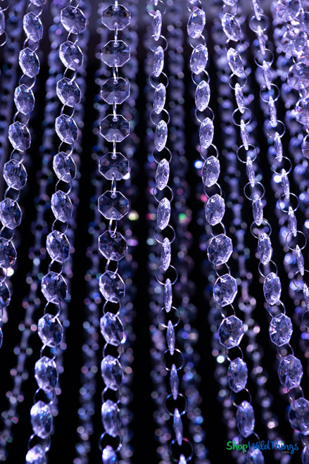 Close-up detail of ¾-inch faceted crystal-clear acrylic bead strands on the Tillie Extra Large Empire chandelier, showing light refraction and sparkle for event decor installations.