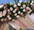 Artificial Silk Roses Fill and Beautify a Ceremony Gazebo by ShopWildThings.com