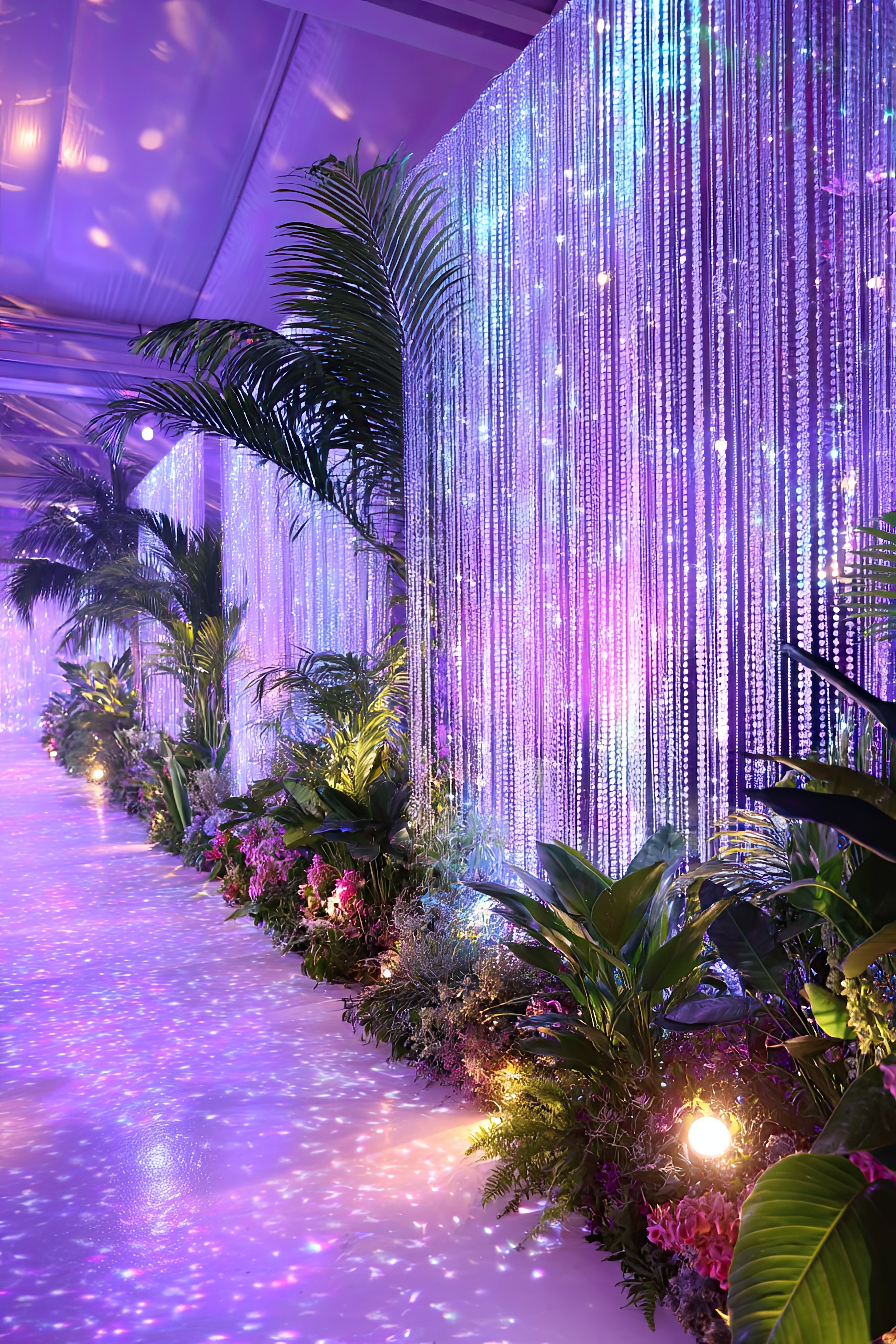 Rainforest Entrance Decor Using Beaded Curtains Frame your guest entry with cascading strands of Diamonds Beaded Curtains and a base of layered palms, ficus, or flowering vines. The mix of lush Greenery with shimmering iridescent beadwork creates a breathtaking scene guests won’t forget—especially when paired with dramatic lighting or sunset tones.