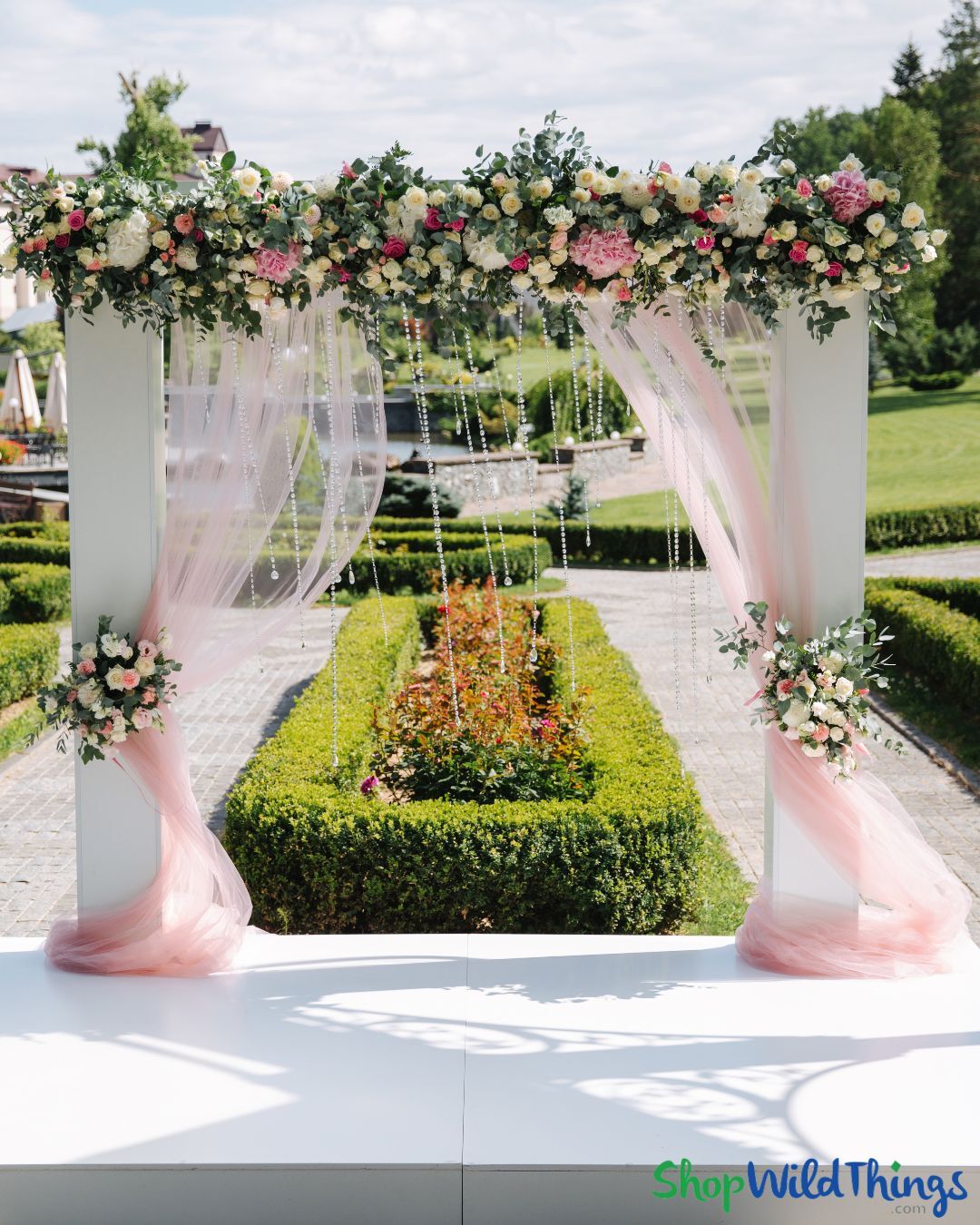 Pink and White Wedding Arch for an Outdoor Wedding Ceremony with Crystal Accents 