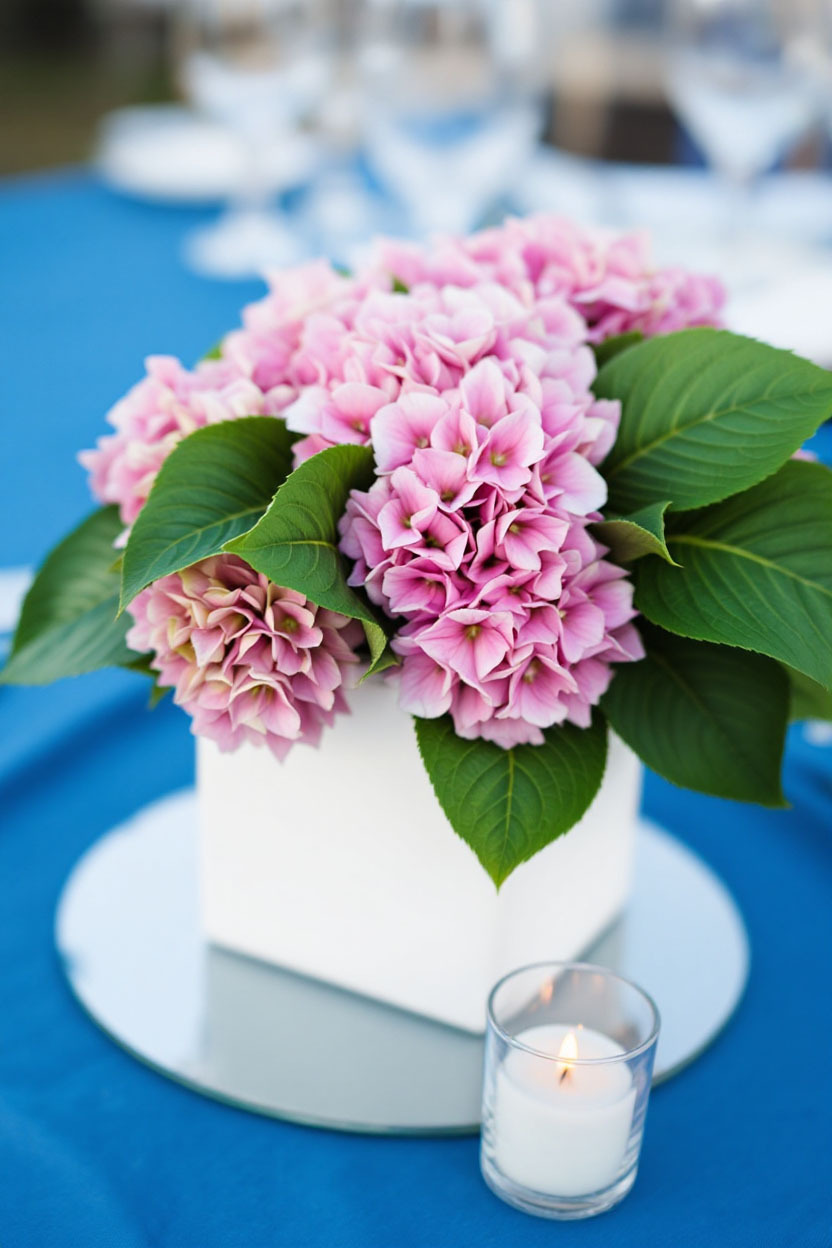 White Cube Vase Centerpiece with Pink Hydrangea Pink hydrangeas in a White Cube Vase is all you need for a sweet and simple statement centerpiece at showers or brunches.
