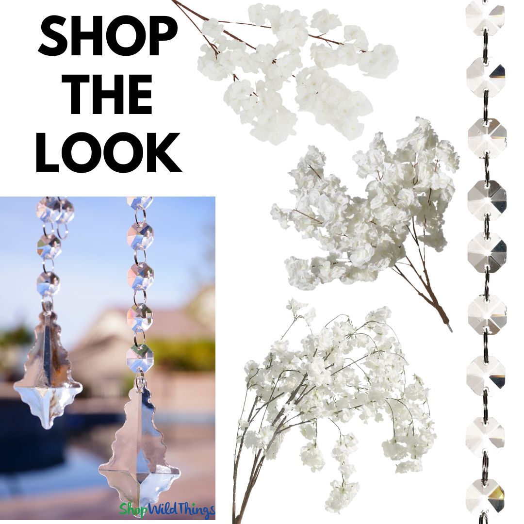 Create a luxurious white and crystal wedding reception tablescape with floral and crystals from ShopWildThings.com