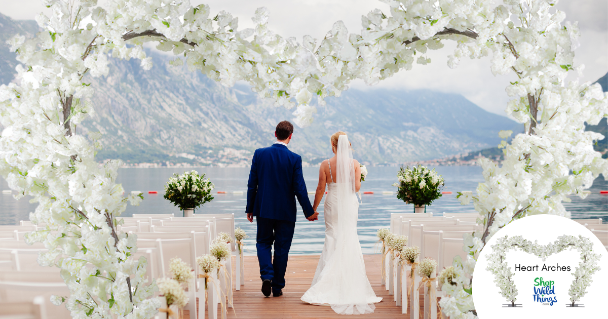 The Flowering Dogwood Tree Wedding Heart Arch by ShopWildThings is perfect for statement wedding ceremony decor or proposals!  