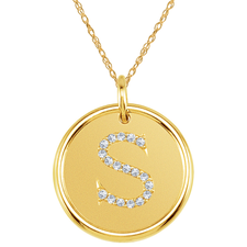 Round halo diamond initial pendant in 14k yellow gold.