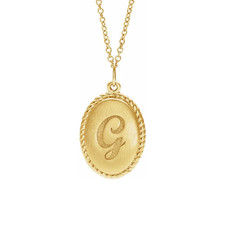 Engraved oval disc rope pendant in 14k yellow gold.