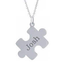 Personalized puzzle piece name pendant in sterling silver.