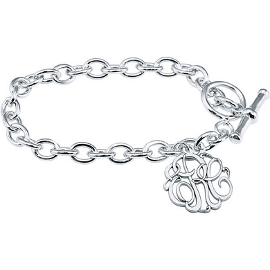 Script monogram cut out letters charm toggle bracelet in sterling silver.