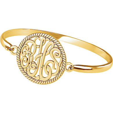 Bangle bracelet with a three script letter monogram in a rope style frame in 14k yellow gold.