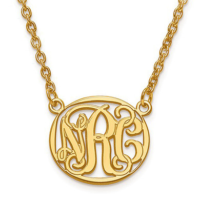 Oval etched monogram three letter cut out pendant necklace in 14K yellow gold.
