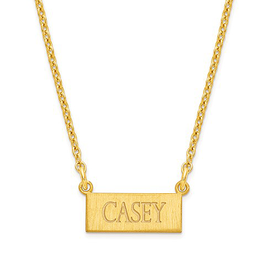 Horizontal brushed finish name bar necklace in 14K yellow gold.