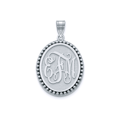 Oval shaped beaded halo disc monogram pendant in sterling silver.