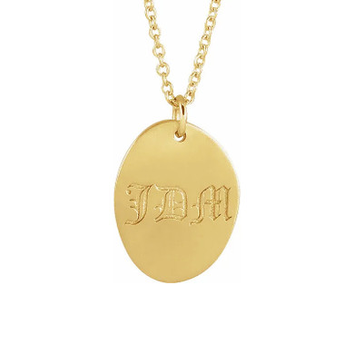 Monogram tiny footprint oval disc pendant in 14k yellow gold.