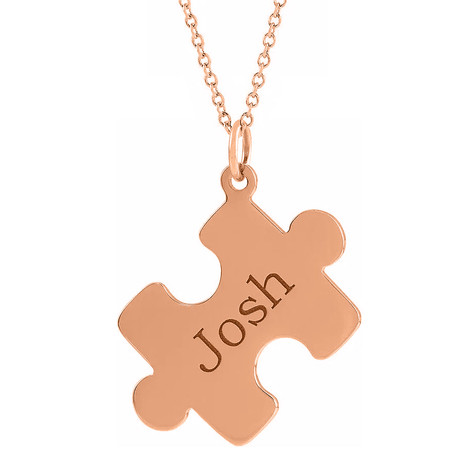 Personalized puzzle piece name pendant in 14k rose gold.