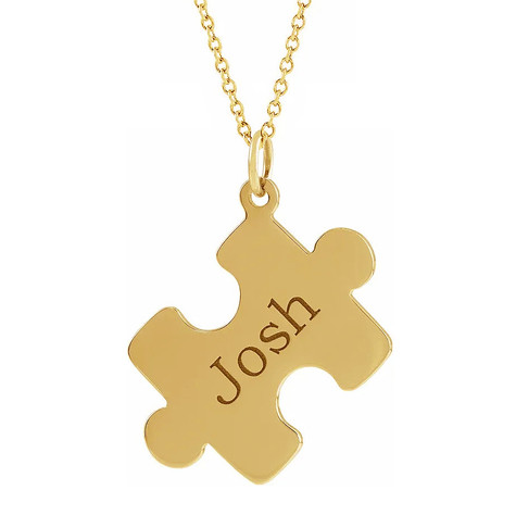 Personalized puzzle piece name pendant in 14k yellow gold.