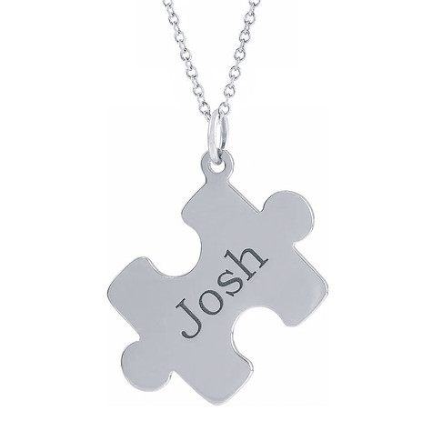 Personalized puzzle piece name pendant in sterling silver.