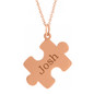 Personalized puzzle piece name pendant in 14k rose gold.