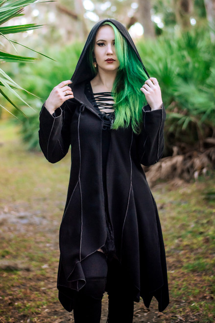 Conjurer's Coat in black hood up front angle. Conjurer's Coat in black hood up front angle.