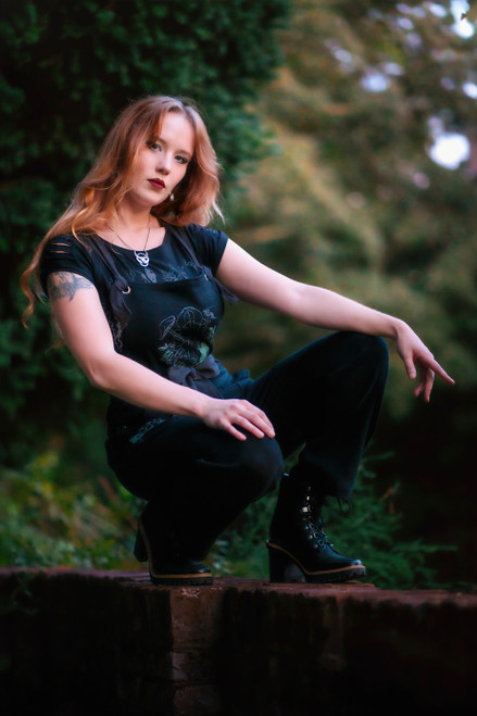 Woman posing wearing Forest Burial Overalls. Woman posing wearing Forest Burial Overalls.